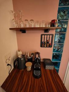 a wooden table with a coffee maker on top of it at Studio am Vierwaldstättersee in Luzern