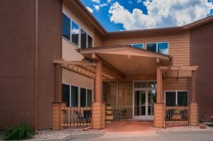 a home with a patio with awning on it at Boulder Twin Lakes Inn in Boulder