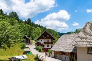 an image of a village with houses and trees at Rudnica House in Bohinj