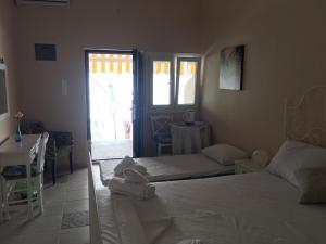 Ένα ή περισσότερα κρεβάτια σε δωμάτιο στο Aphrodites Apartments