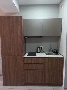 Η κουζίνα ή μικρή κουζίνα στο Bakuriani Crystal Loft 406