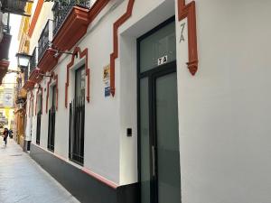 a building with a door on the side of a street at Olavide Premium Apartments in Seville