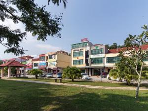 a building with a park in front of it at CHARISMA HOTEL in Kuantan