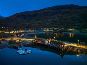 an aerial view of a harbor at night at Manndalen Sjøbuer in Samuelsberg