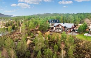 an aerial view of a house on a hill with trees at Awesome Home In Mykland With Kitchen in Mykland