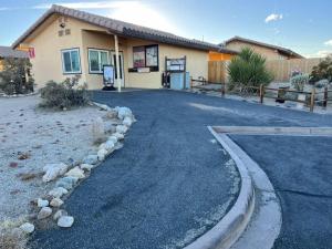 a road in front of a building at Joshua Tree National Park - Cozy Palms Getaway in Twentynine Palms