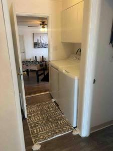 a kitchen with a washer and dryer in a room at Joshua Tree National Park - Cozy Palms Getaway in Twentynine Palms