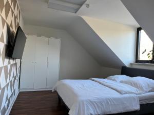 En eller flere senge i et værelse på Monteurwohnung Mönchengladbach Geroweiher