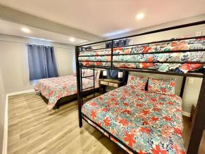 a bedroom with two bunk beds and a bed at 4 Bedrooms House with Private Pool and Spa 2 Min Walk To The Beach - Zula Siesta Beach House in South Padre Island +42 photos