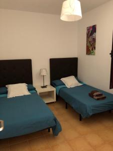 En eller flere senge i et værelse på Casa Acebuche + 22 billeder