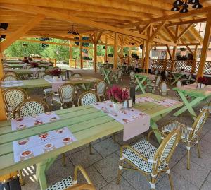 a group of tables and chairs in a patio at Hanul Greweln in Mediaş