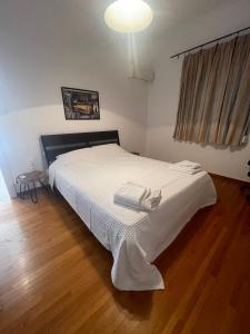 Posteľ alebo postele v izbe v ubytovaní PAGRATI FLAT 7 + 18 fotografií