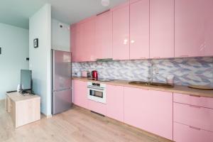 Kuchyňa alebo kuchynka v ubytovaní Bukowska 18 Apartments MTP Poznań by Noclegi Renters