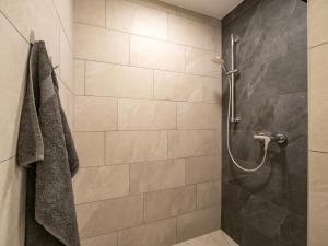 a bathroom with a shower with a glass door at Residenz Brixental Top 2 in Brixen im Thale