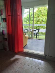 a sliding glass door with a view of a patio at RESIDENCE MELINDA in Dijon