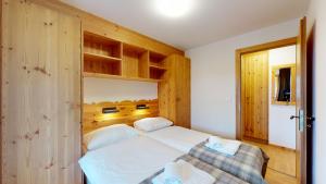 Postel nebo postele na pokoji v ubytování Pracondu 1 403 - OUTDOOR & FUN charming apartment