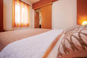 Postel nebo postele na pokoji v ubytování Apartments Ivica