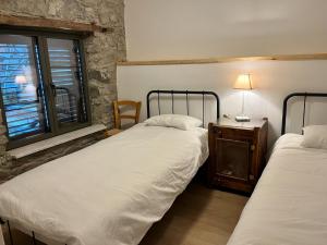 Postel nebo postele na pokoji v ubytování Balkoni Moutoullas
