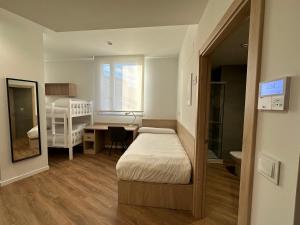 Postel nebo postele na pokoji v ubytování Micampus San Mamés Students Residence + 37 fotografií