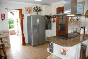 a kitchen with a stainless steel refrigerator at Bonito-Sol in Sitio de Calahonda