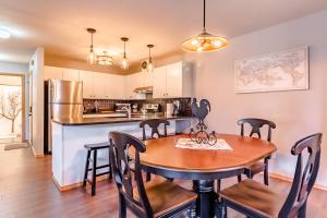 a kitchen and dining room with a table and chairs at European Escape in Leavenworth