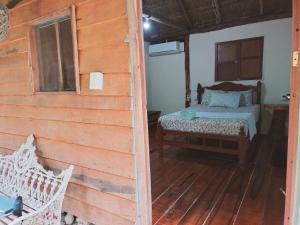 Cama ou camas em um quarto em Villa Akbal