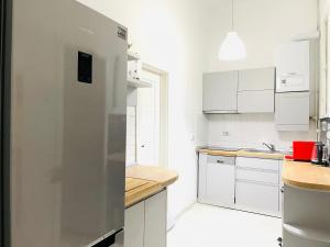 Kuchyň nebo kuchyňský kout v ubytování CenterApartment + 6 fotografií