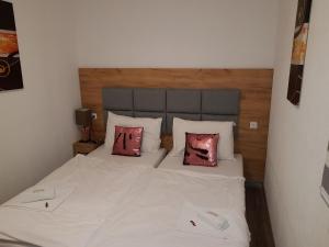 Krevet ili kreveti u jedinici u okviru objekta Pension Central Semmering