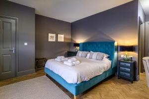 Tempat tidur dalam kamar di The Globe Inn