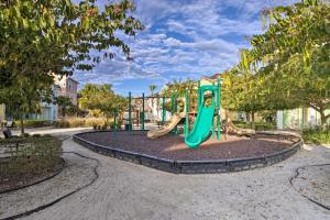 a playground with a slide in a park at Margaritaville Home and Hot Tub, 3 Mi to Disney in Orlando