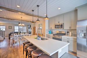 a kitchen with a large island and a counter top at Cozy Townhome about 7 Mi to Deer Valley Resort in Keetley Junction
