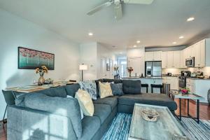 a living room with a couch and a kitchen at Rehoboth Beach Vacation Rental with Porch! in Rehoboth Beach