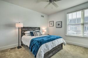 a bedroom with a bed and a ceiling fan at Patio and Pool Access Rehoboth Beach Retreat in Rehoboth Beach +24 photos