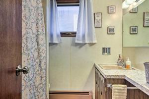 a bathroom with a sink and a window at Salamanca Home about 9 Mi to Holiday Valley Resort in Salamanca +16 photos