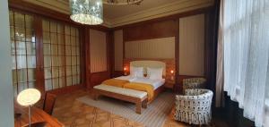 Postel nebo postele na pokoji v ubytování Hotel Okresní Dům