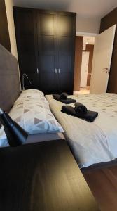 Postel nebo postele na pokoji v ubytování Apartman Urban & 4