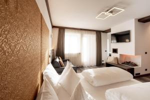 Voodi või voodid majutusasutuse Hotel Chalet Sas Morin toas
