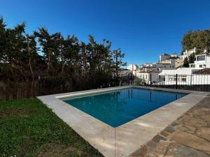 a swimming pool in the backyard of a house at House with private pool in central Mijas Pueblo in Mijas
