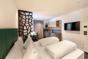 Voodi või voodid majutusasutuse Hotel Chalet Sas Morin toas