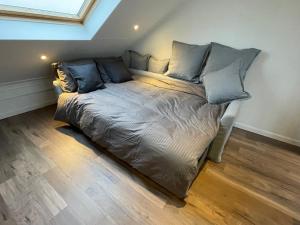 a bed in the corner of a room at TopSleep Apartment 26-3 in Arnhem