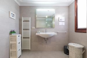 a bathroom with a sink and a mirror at Casa Rural Zelaieta BerriBi in Itziar