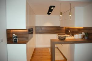 a kitchen with a wooden counter and a sink at Timeless Charming - Belém in Lisbon