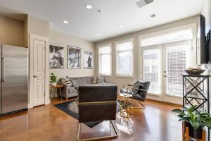 a living room with a couch and chairs at Cashville - Stylish Condo Minutes from Broadway in Nashville