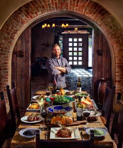 a man standing in front of a table with food at Tubac Golf Resort & Spa in Tubac