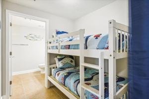 a bunk bed room with two bunk beds at Gone Coastal - Tidewater Beach Resort #2410 by Book That Condo in Panama City Beach