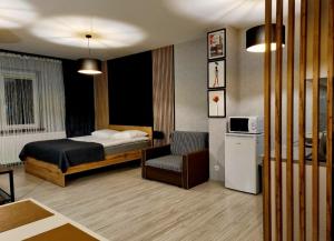 Posteľ alebo postele v izbe v ubytovaní Willa "Aparthause" E-Apartamenty