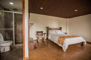 Hotel Campestre La Posada Del Rancho客房内的一张或多张床位