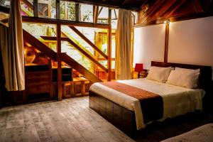 Hotel Campestre La Posada Del Rancho客房内的一张或多张床位