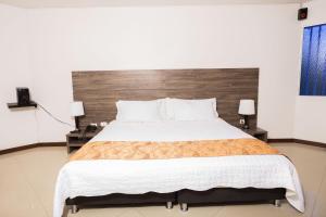 Hotel Campestre La Posada Del Rancho客房内的一张或多张床位