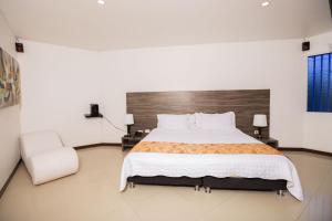 Hotel Campestre La Posada Del Rancho客房内的一张或多张床位